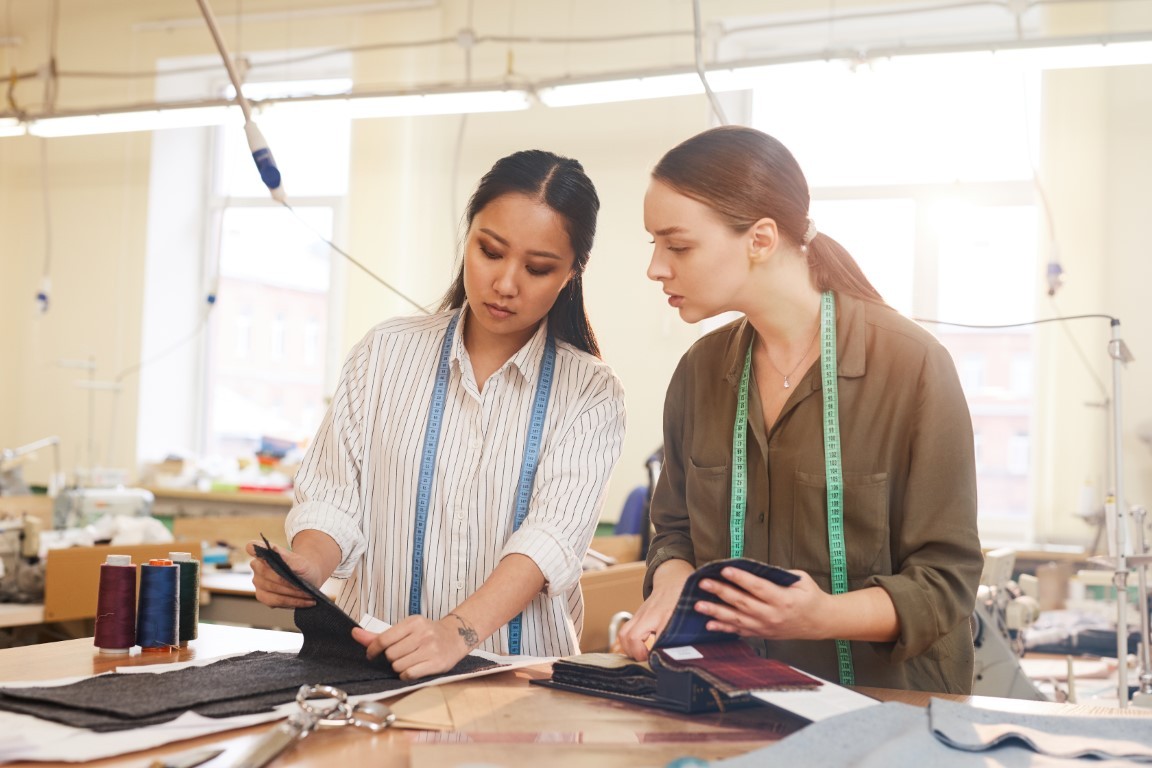 Designers choosing fabric in team