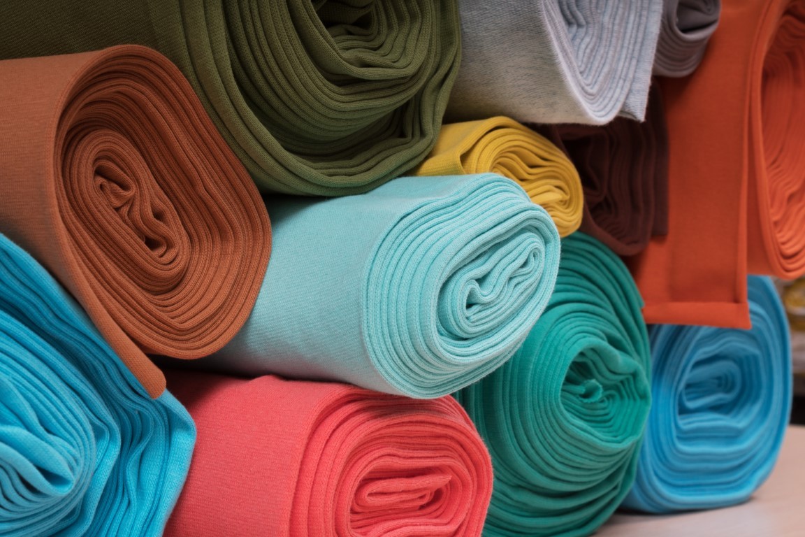 Rolls of knitted fabric in assortment