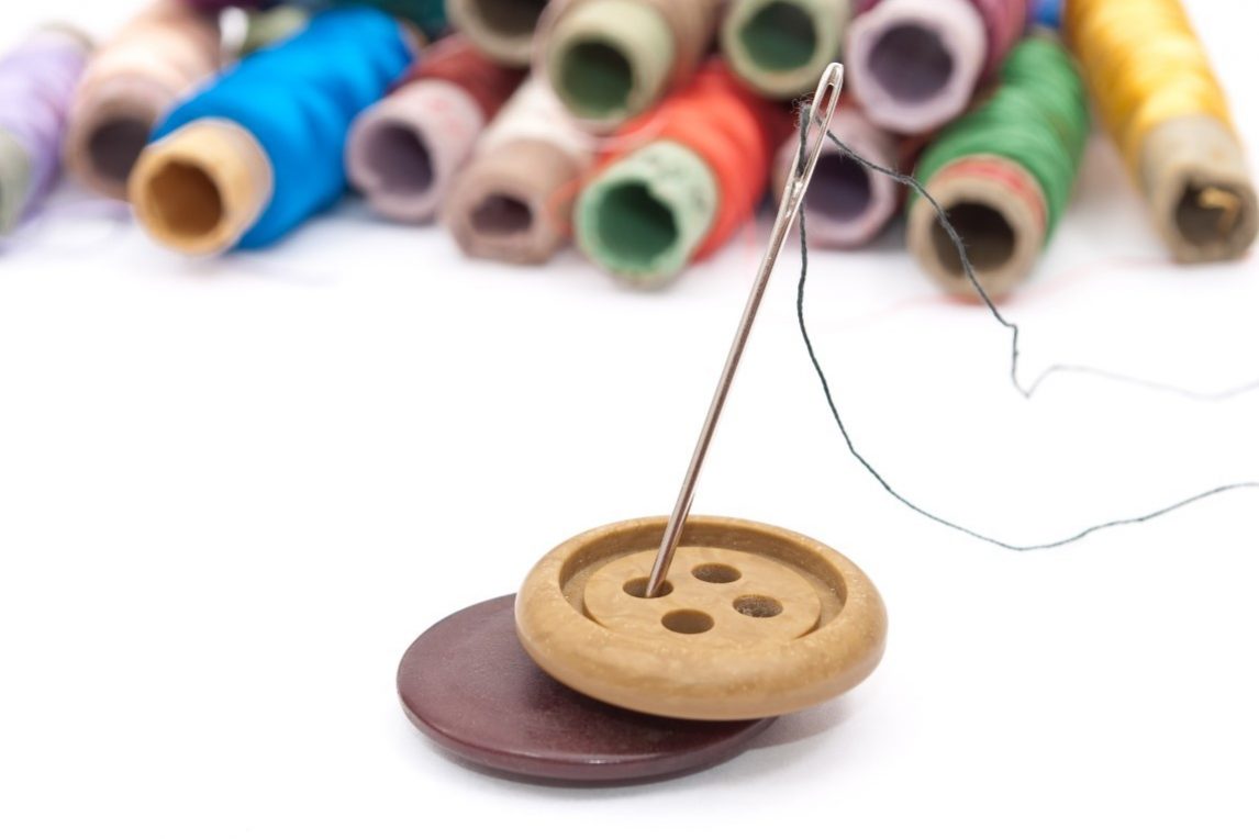 Buttons and threads with a needle
