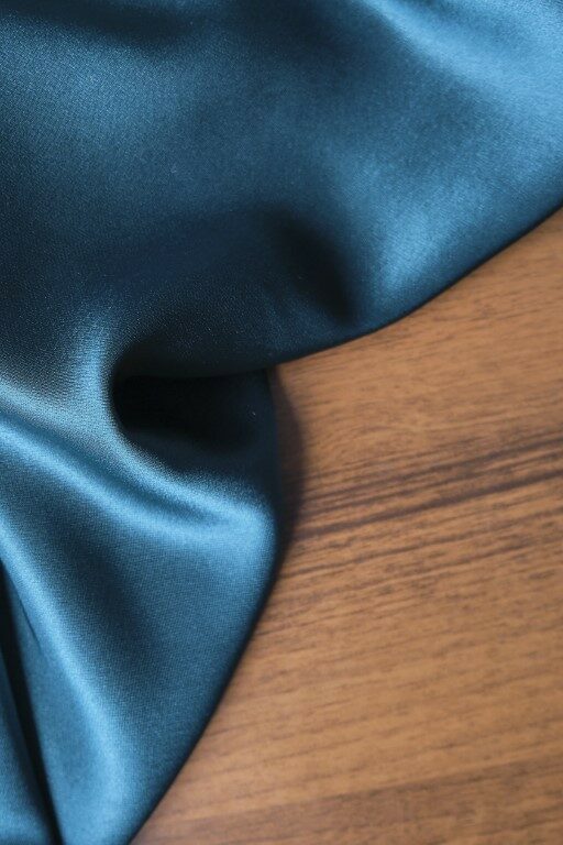 Blue silk drapery and upholstery fabric from the courtyard. Blue satin