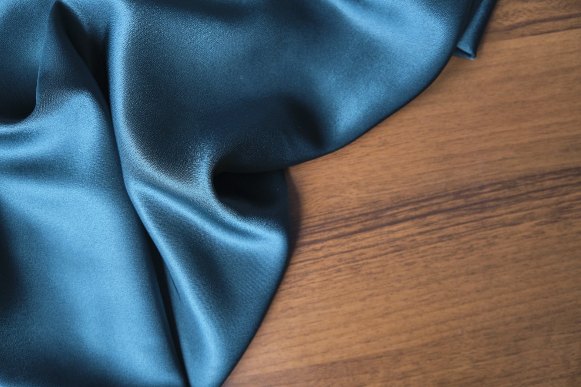 Blue silk drapery and upholstery fabric from the courtyard. Blue satin