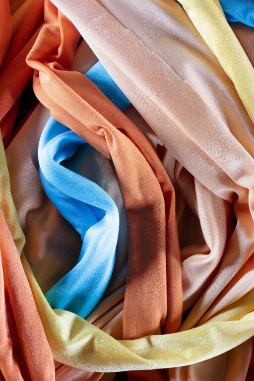 A group of multicolored cloth drapes