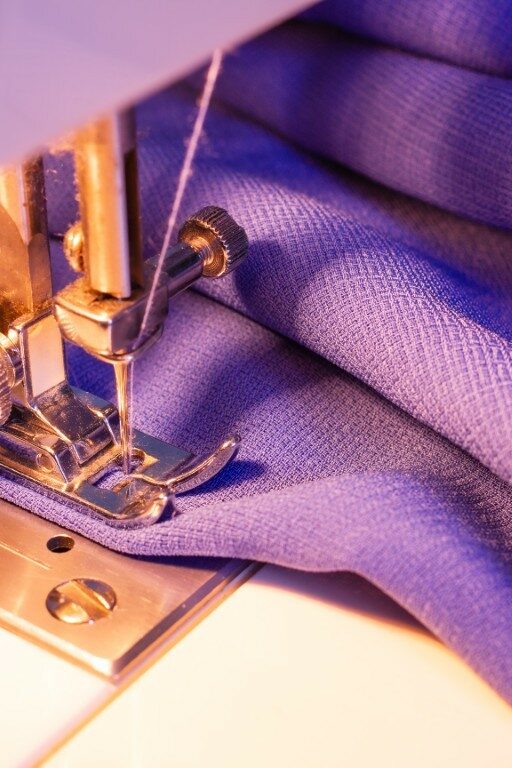 sewing-machine-close-up-on-purple-fabric-2026-03-09-09-00-43-utc