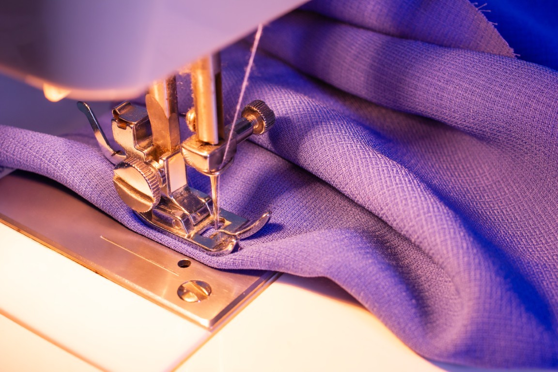 sewing-machine-close-up-on-purple-fabric-2026-03-09-09-00-43-utc